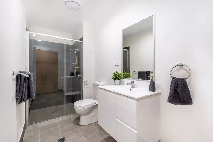 Bathroom with shower and vanity in the Petrie Village unit for rent