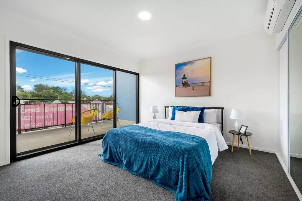 Second bedroom with balcony access in the 2 bedroom Petrie Village unit